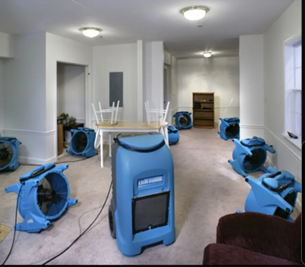 Air movers and dehumidifier setup for Water Damage Restoration in Randolph